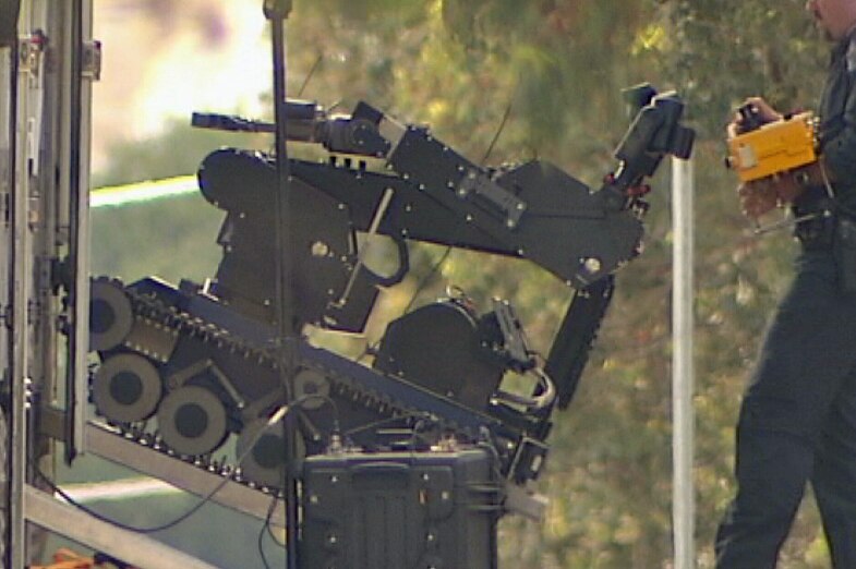Police used a sophisticated equipment to inspect the package outside the childcare centre.