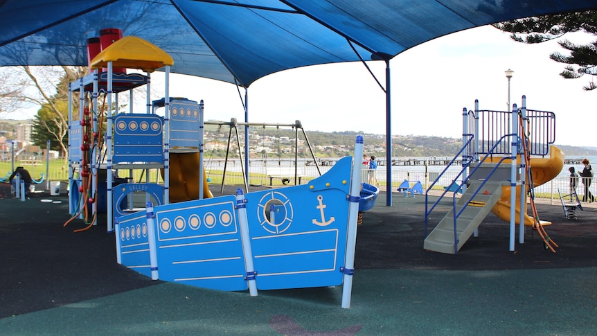 Blue boat-shaped playground equipment 