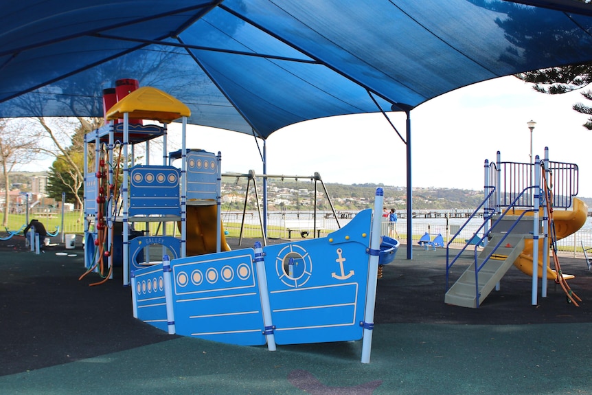 Blue boat-shaped playground equipment 