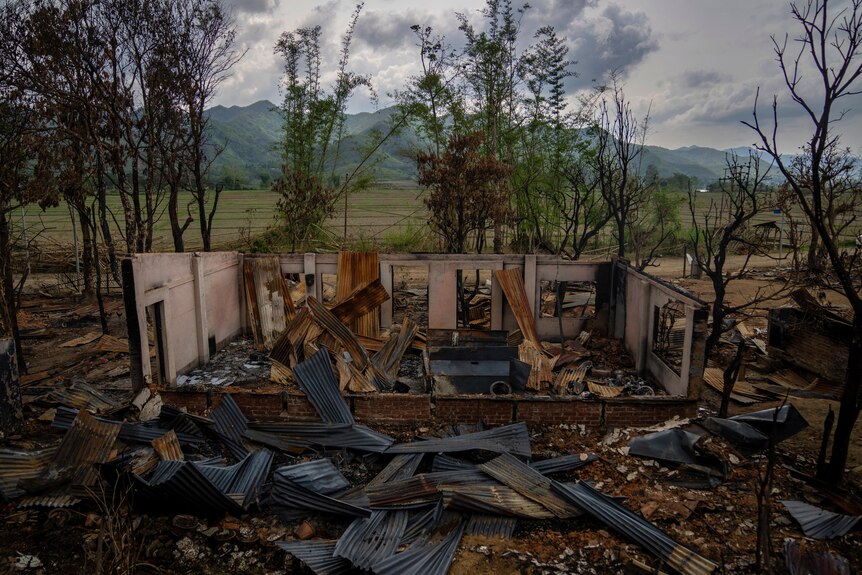 The shell of a burnt houses stands following ethnic clashes and rioting in a remote Indian state.