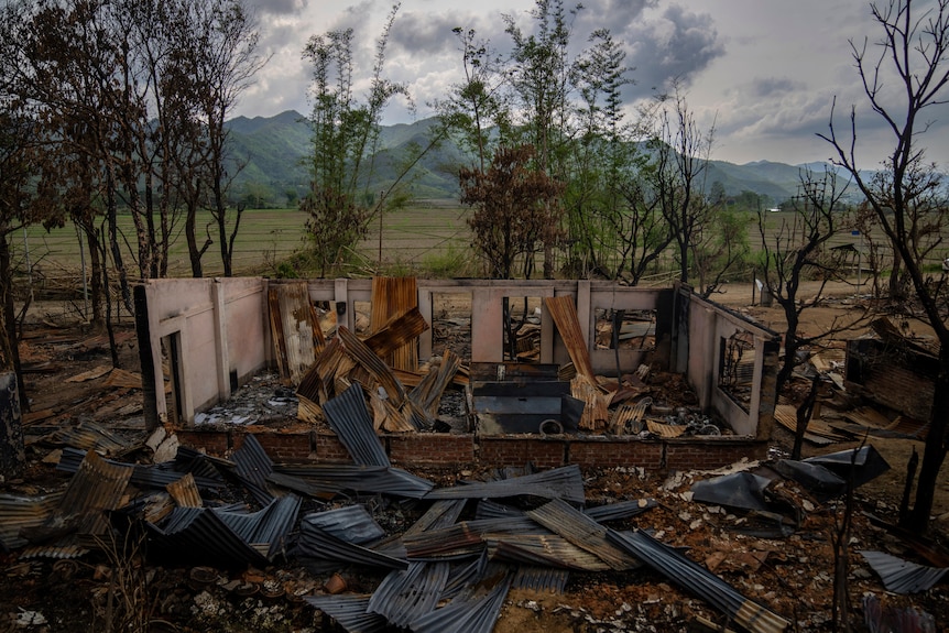 The shell of a burnt houses stands following ethnic clashes and rioting in a remote Indian state.