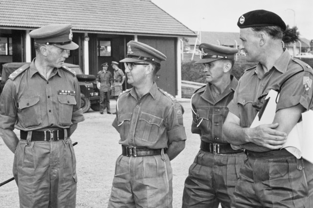 Major Peter Badcoe (second from the left) in Singapore.