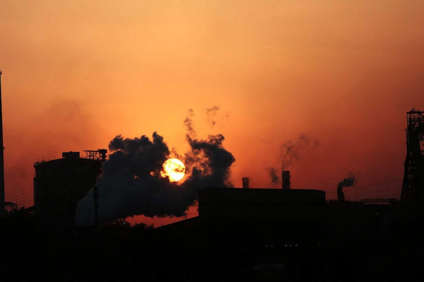 Plumes of smoke float over the Ilva steel factory at Taranto.