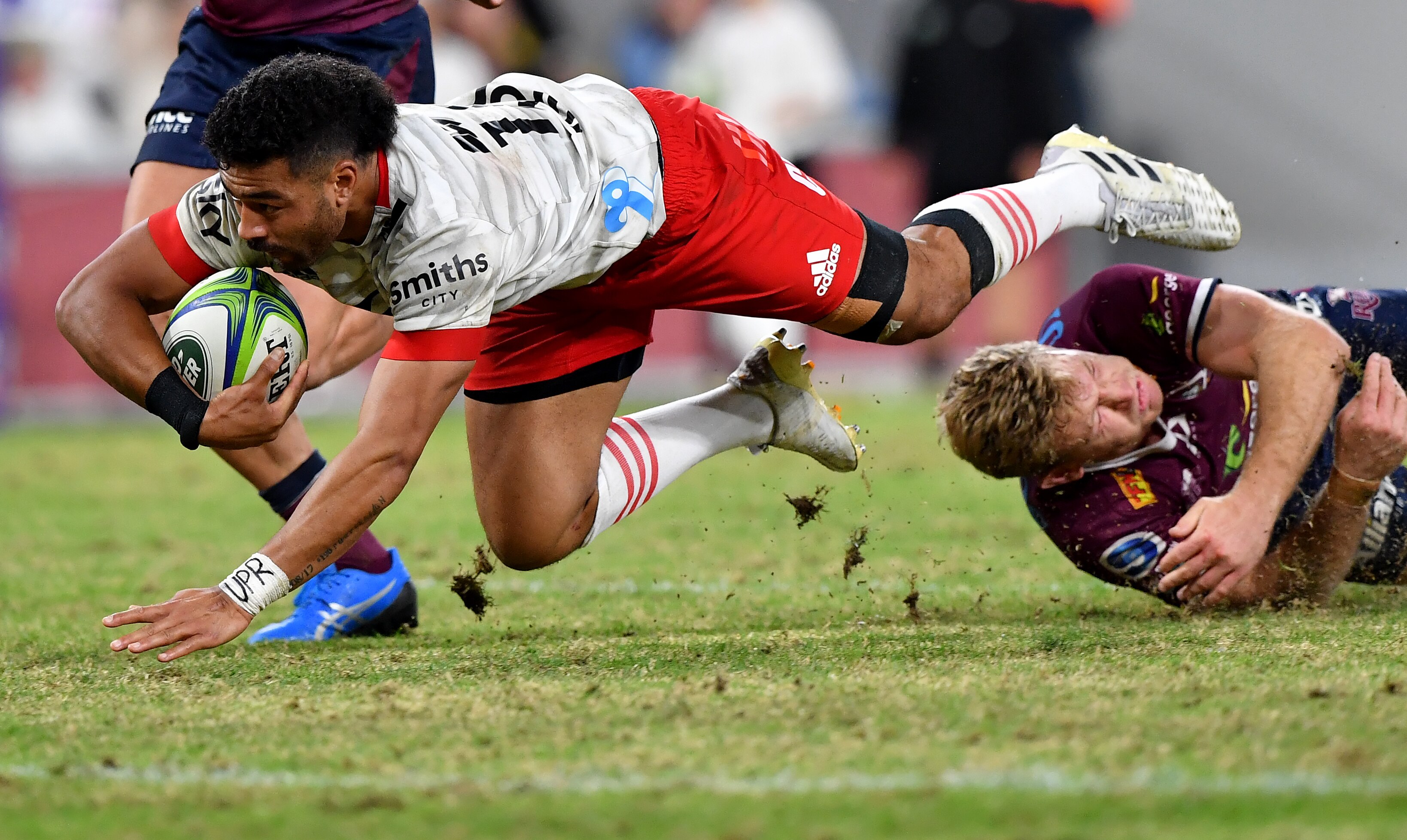 Rugby union player in the action of scoring a try 