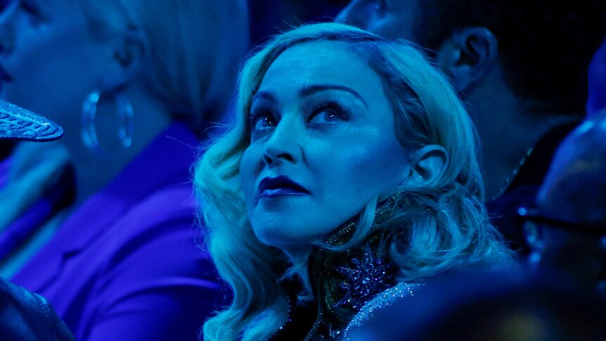 Madonna looks back during an awards show.