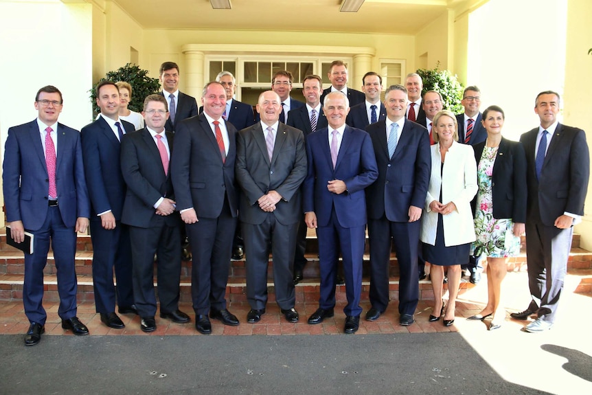 Prime Minister Malcolm Turnbull poses with new members of his ministry.