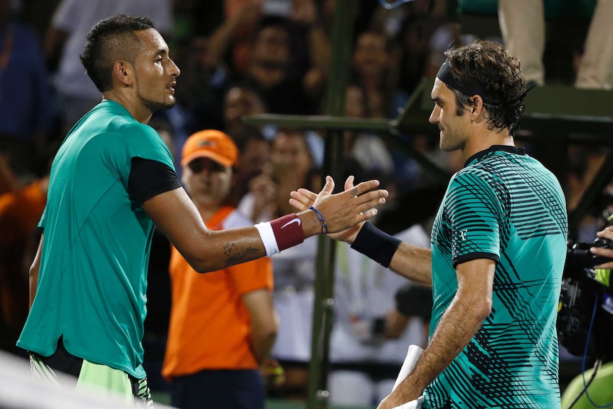Nick Kyrgios and Roger Federer shake hands in Miami