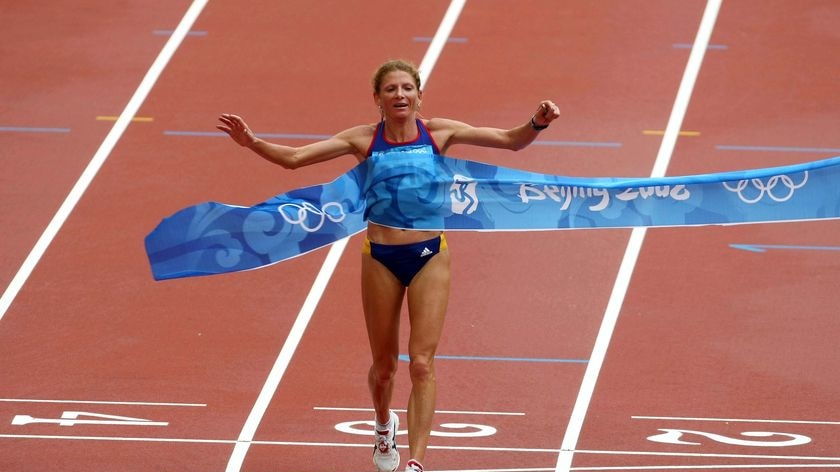 Constantina Tomescu crosses the finish line to win the women's marathon
