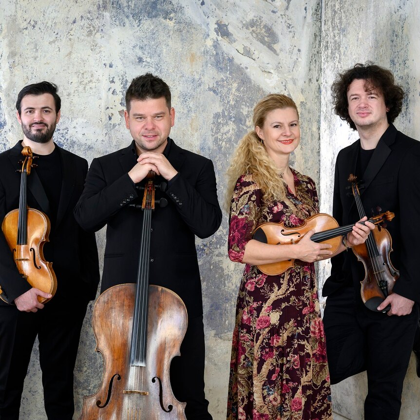 Pavel Haas Quartet standing, Luosha Fang (viola), Peter Jarůšek (cello), Veronika Jarusková and Marek Zwiebel (violins).