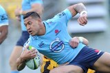 Israel Folau is brought down by the Hurricanes defence