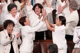 Democratic female members of Congress cheer after US President Donald Trump said there are more women in Congress than ever.