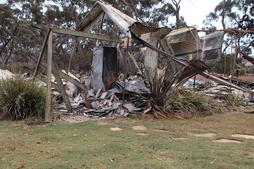 A twisted pile of metal that used to be a house