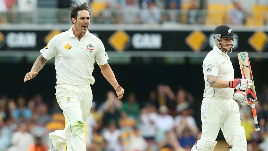 Mitchell Johnson leaps in the air after dismissing McCullum