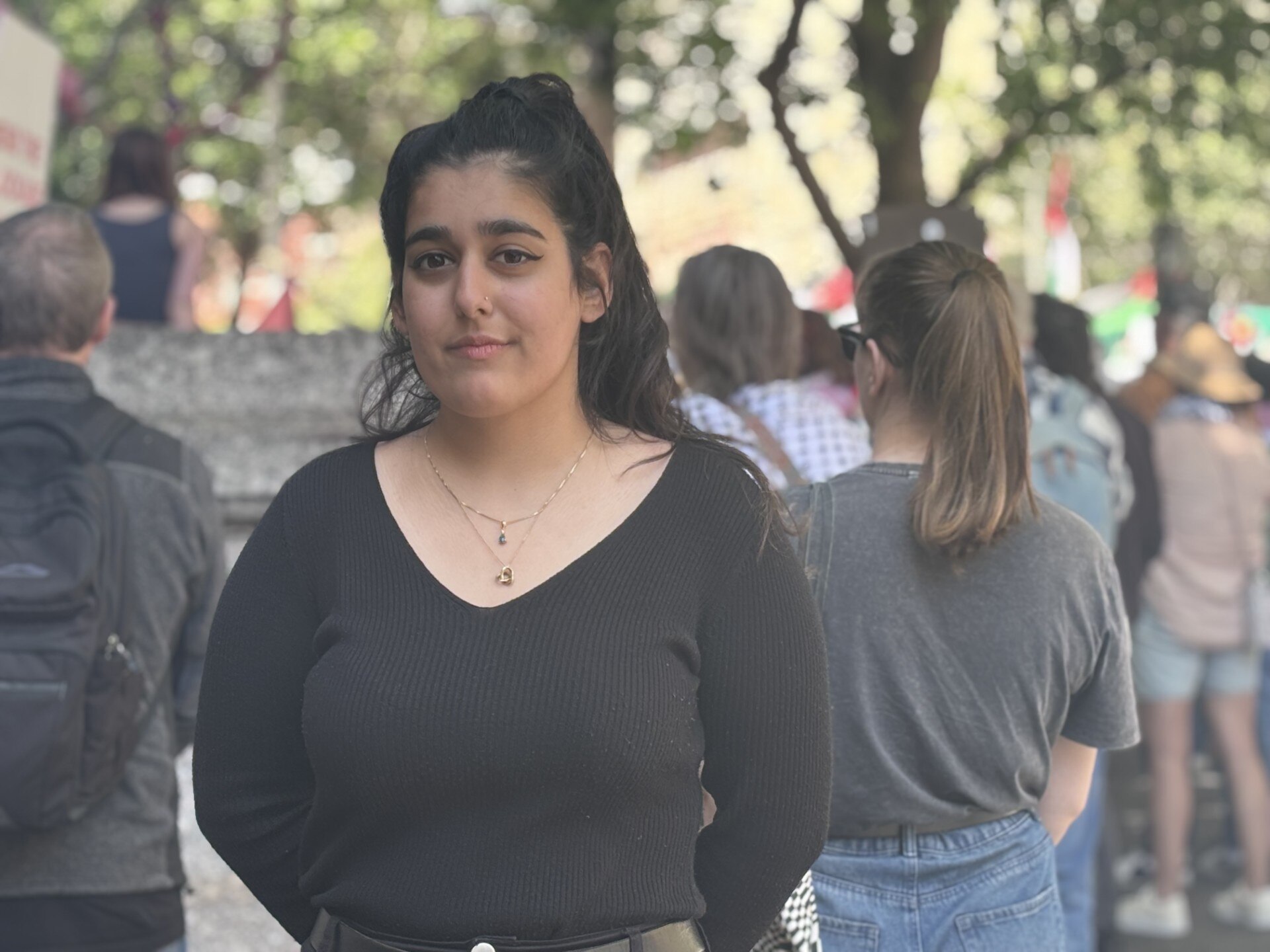 pro-palestine protester Doha Khan looks at the camera at the adelaide rally