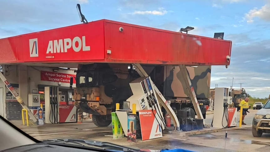 A large army truck crashed into a petrol station