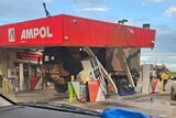 A large army truck crashed into a petrol station