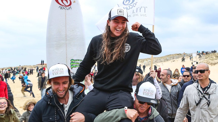 Tyler Wright celebrates her surfing world title