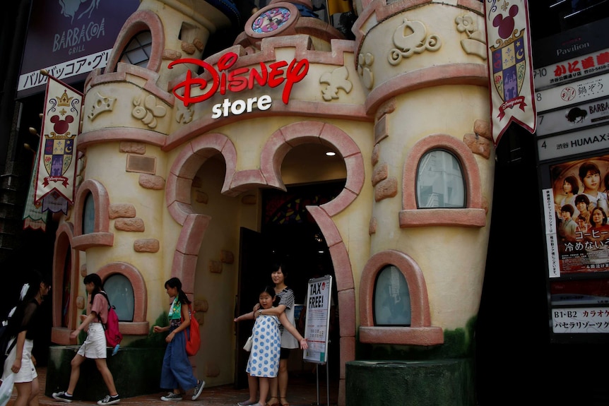 Children and other people in front of the Disney store in Tokyo.