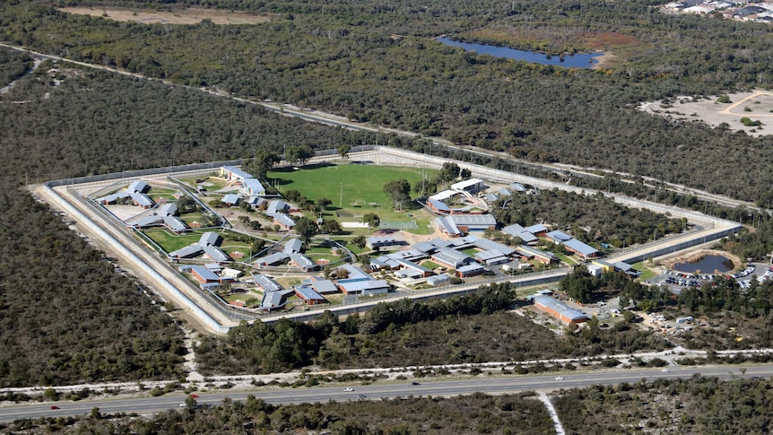 An aerial photo showing a group of buildings and a grassed oval.