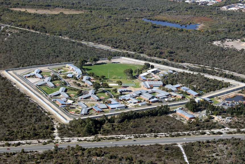 An aerial photo showing a group of buildings and a grassed oval.