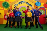 Children's music group the Wiggles, colourfully dressed and on a colourful set.