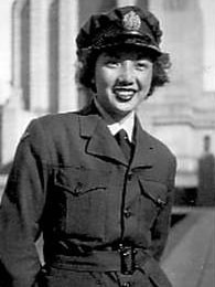 A black and white photo of a young Chinese woman in Australian military uniform.