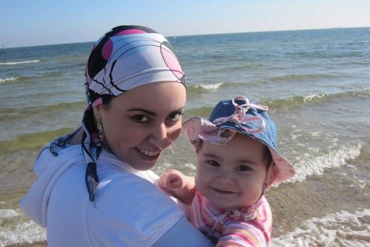 Dassi Erlich at the beach with her baby daughter