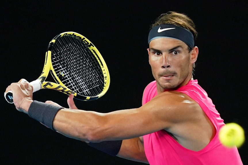 Rafael Nadal winds up a slice backhand at the Australian Open.
