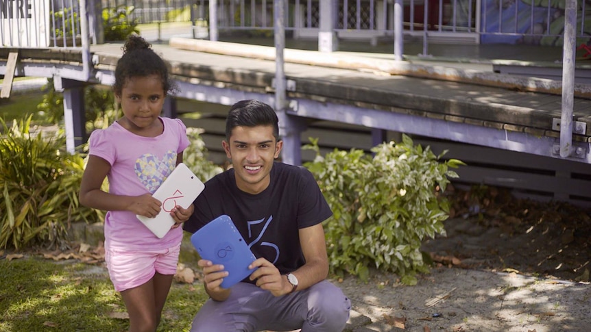 Taj Pabari in far north Queensland teaching children how to assemble their own computer tablet.