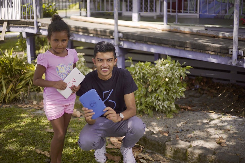 Taj Pabari in far north Queensland teaching children how to assemble their own computer tablet.