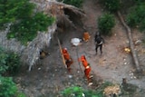 Members of one of the world's last uncontacted tribes fire arrows at the plane flying over their settlement.
