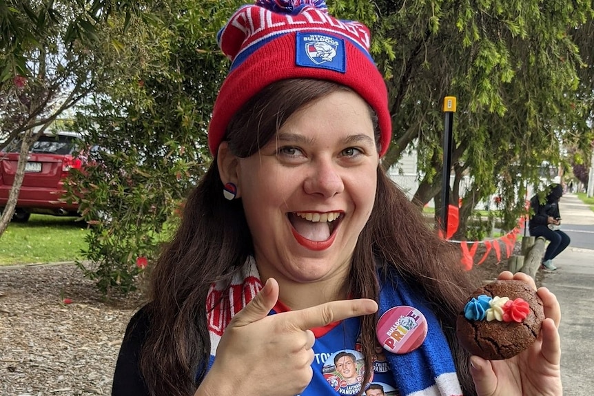 Connor Borchard-Burns wears a Western Bulldogs AFLW pride guernsey and beanie