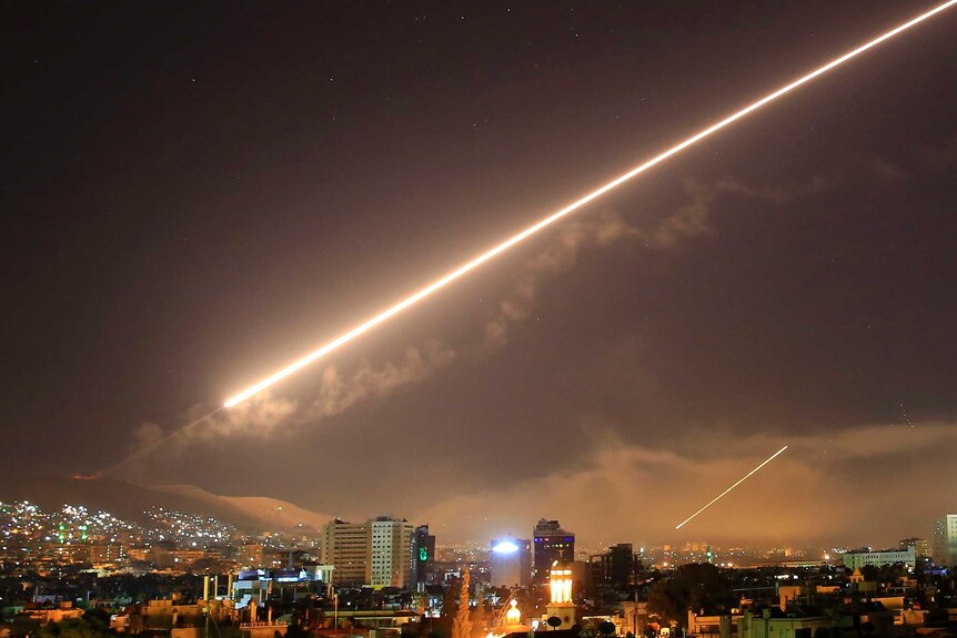 US airstrikes are seen in the Damascus night sky