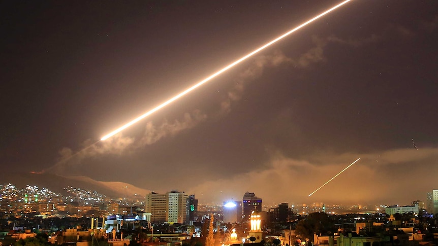 US airstrikes are seen in the Damascus night sky