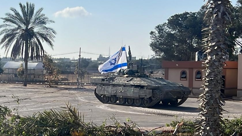 Two tanks with Israeli flags on them. 