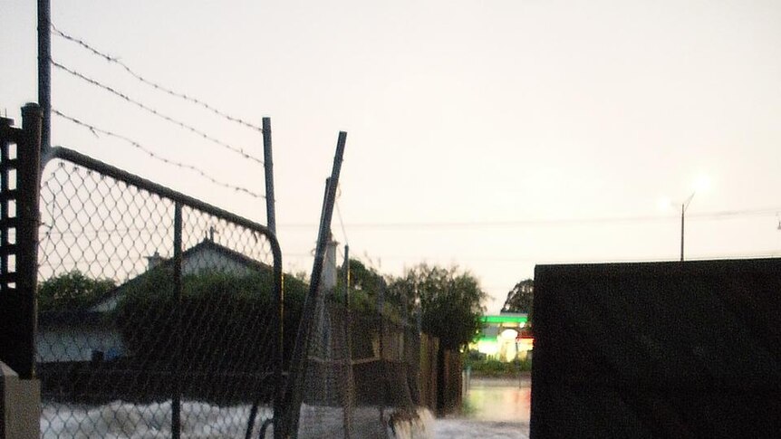 Water overflows from a canal in the Melbourne suburb of Gardenvale.