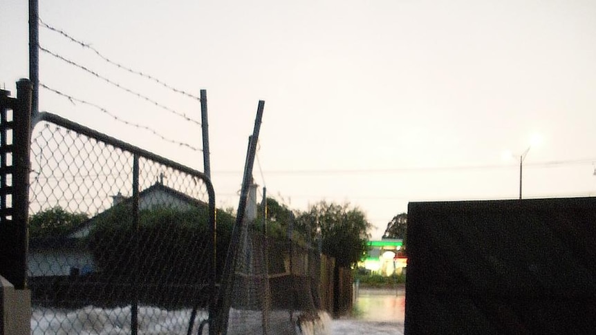 Water overflows from a canal in the Melbourne suburb of Gardenvale.