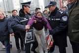Protester detained by police outside trial of Xu Zhiyong in Beijing