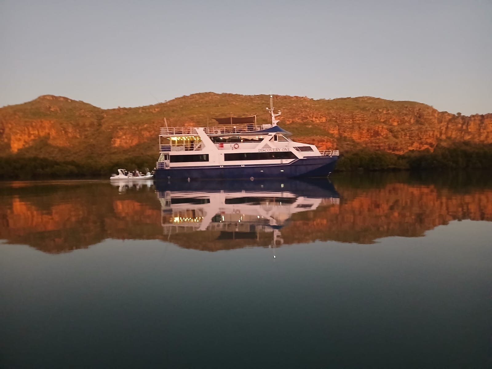 A large boat floats on the water