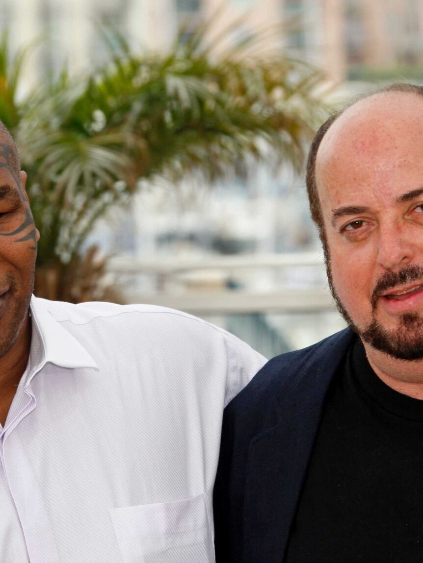 Mike Tyson left with his arm around director James Toback at the Cannes film festival.