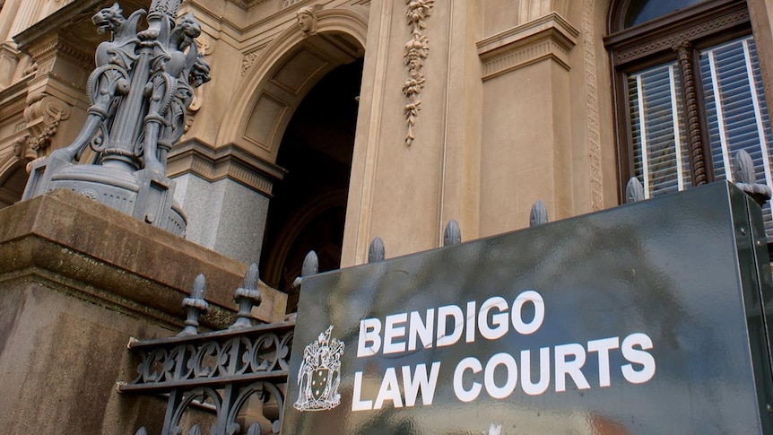 The outside of a forbidding old building with a sign that reads "Bendigo Law Courts",