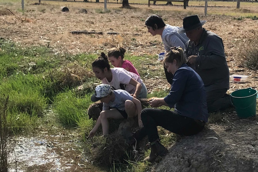 North Central CMA's Amy Russell and Turtles Australia volunteer Graham Stockfeld with Cohuna residents