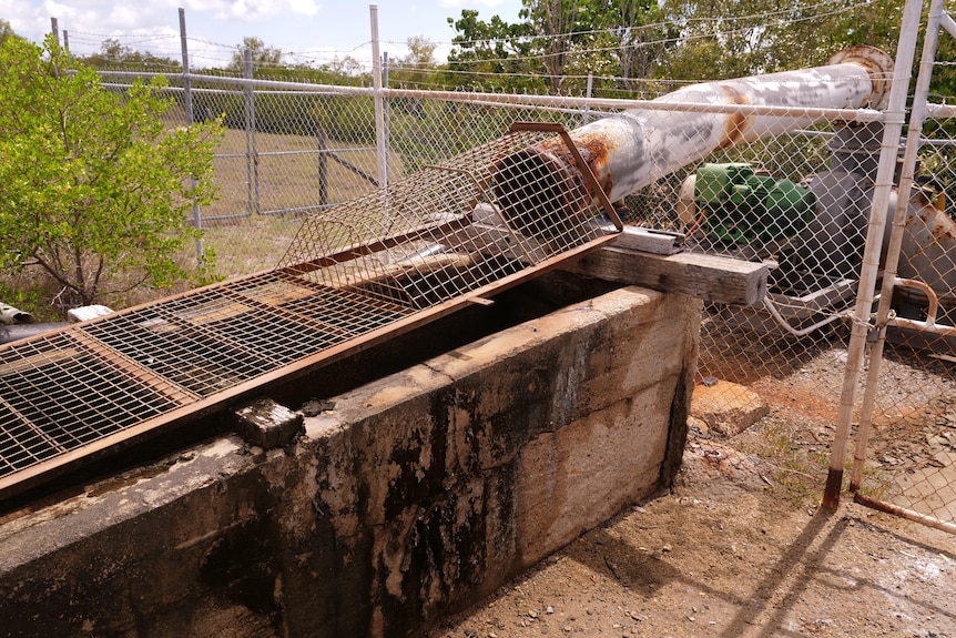 The pipe at the Bowen saltworks where saltwater flows from the ocean to the evaporation ponds