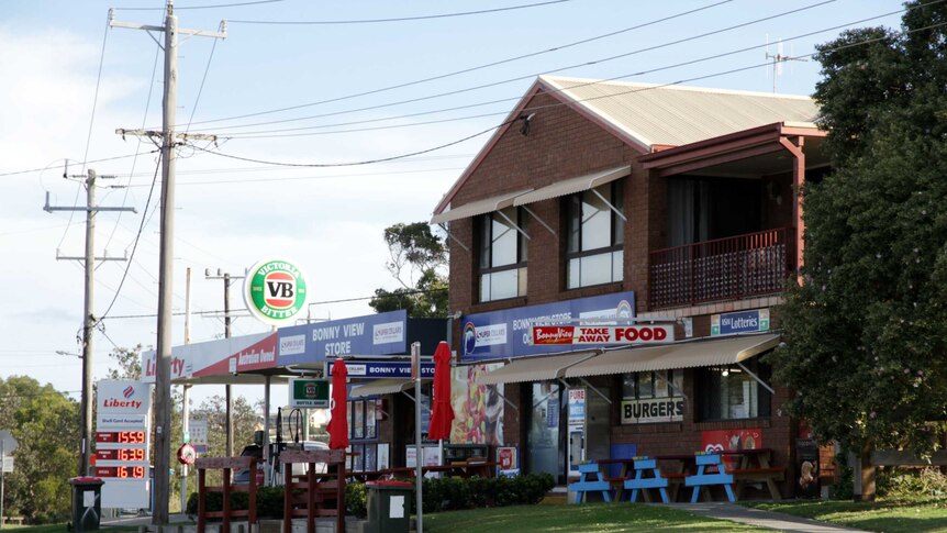 Photo of shops, including take-away restaurants and petrol station, in the NSW town of Bonny Hills.