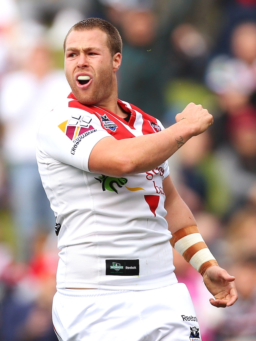 Dragons prop Trent Merrin celebrates a try against the Roosters in August 2011.