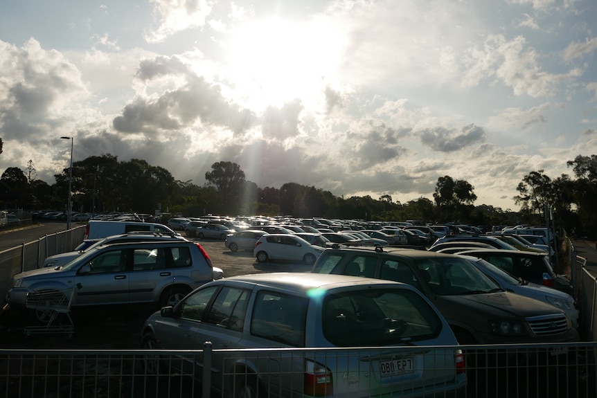 A crowded car park. 