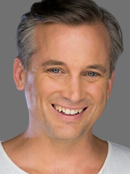 Head shot of a man smiling at the camera