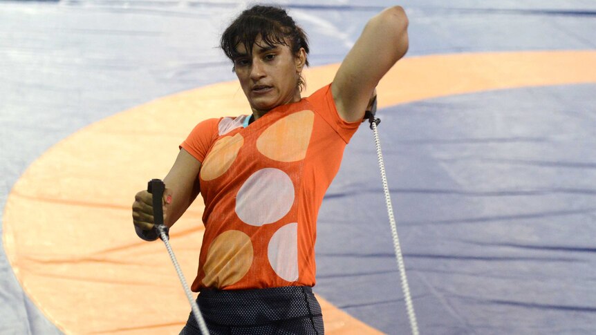 Indian wrestler Vinesh Phogat takes part in a practice session in a gym in Lucknow on May 24, 2016.