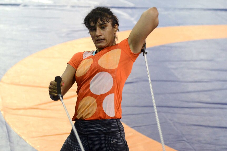 Indian wrestler Vinesh Phogat takes part in a practice session in a gym in Lucknow on May 24, 2016.