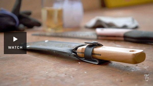 Hand-held gardening tools on a wooden work bench. Has Video.